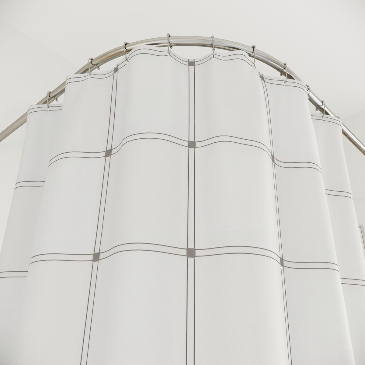 White windowpane with fine warm-gray double lines shower curtain with close-up print, hooks, and folds