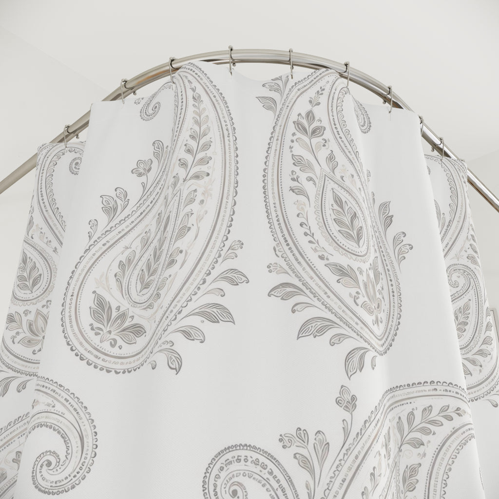 Pale gray leafy paisleys on a bright white ground shower curtain with close-up print, hooks, and folds