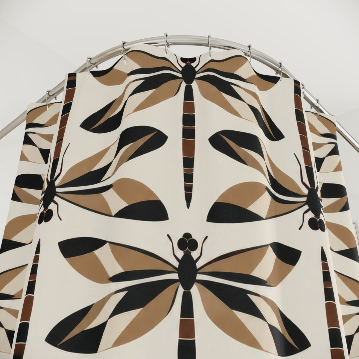 Black and tan geometric dragonflies on ivory shower curtain with close-up print, hooks, and folds