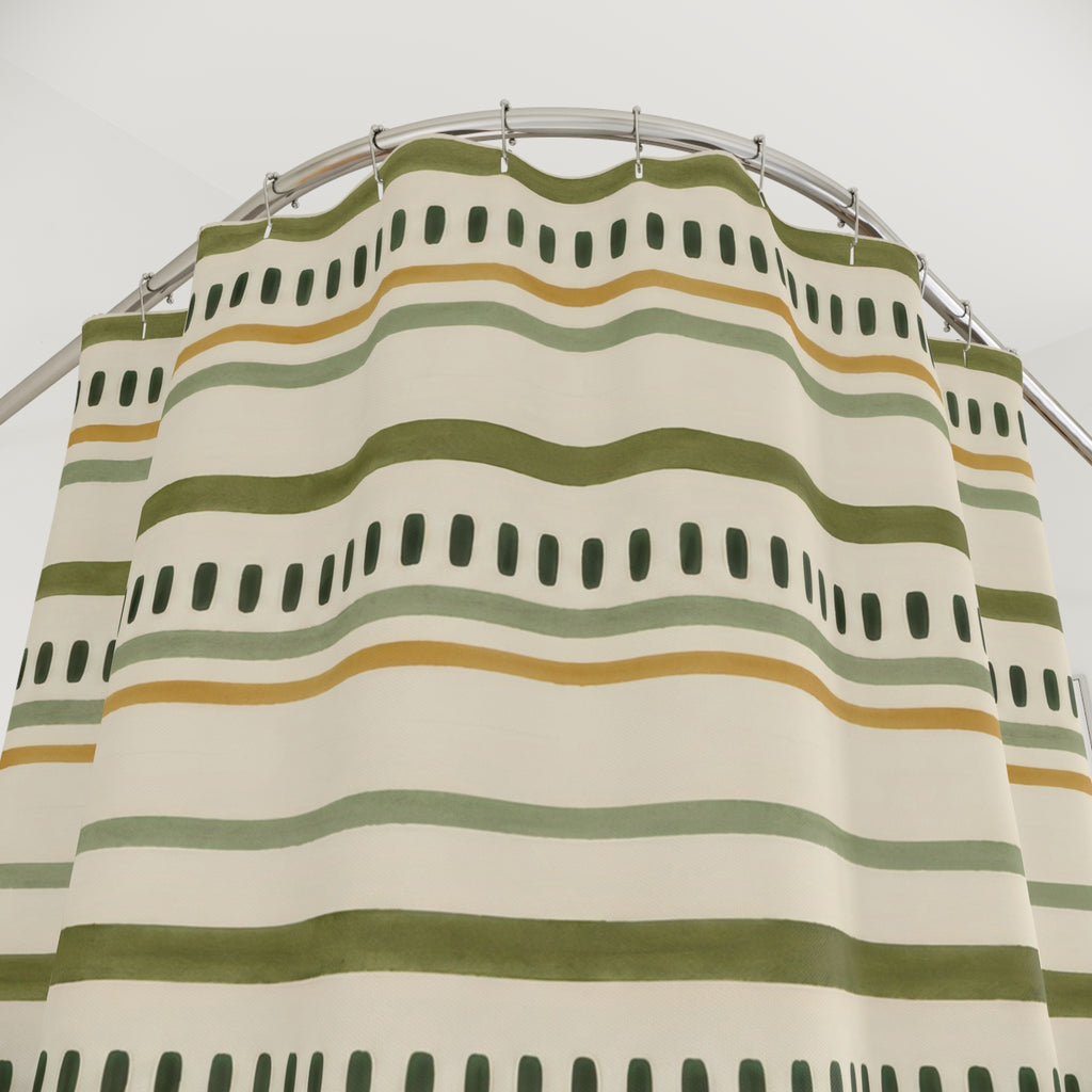 Olive and sage lines with forest-green dash rows on cream shower curtain with close-up print, hooks, and folds