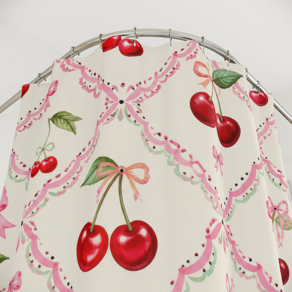 Red cherries and pink bows in a cream trellis pattern shower curtain with close-up print, hooks, and folds