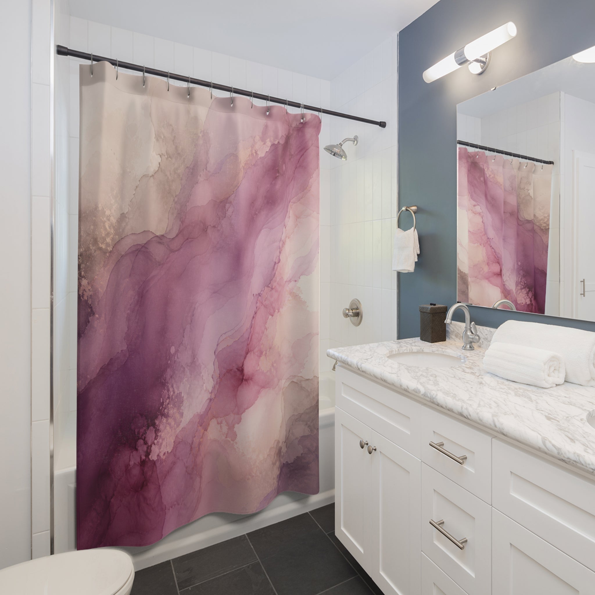 Mauve watercolor pigment currents with dusty rose blooms shower curtain beside a white vanity