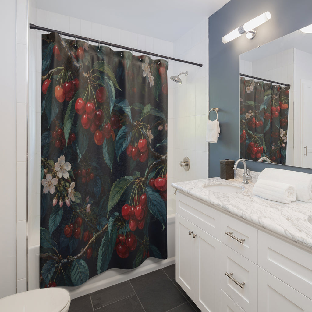 Red cherry branches with ivory blossoms on navy shower curtain beside a white vanity