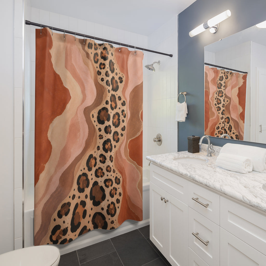 Cheetah print flowing through terracotta canyon shapes shower curtain beside a white vanity