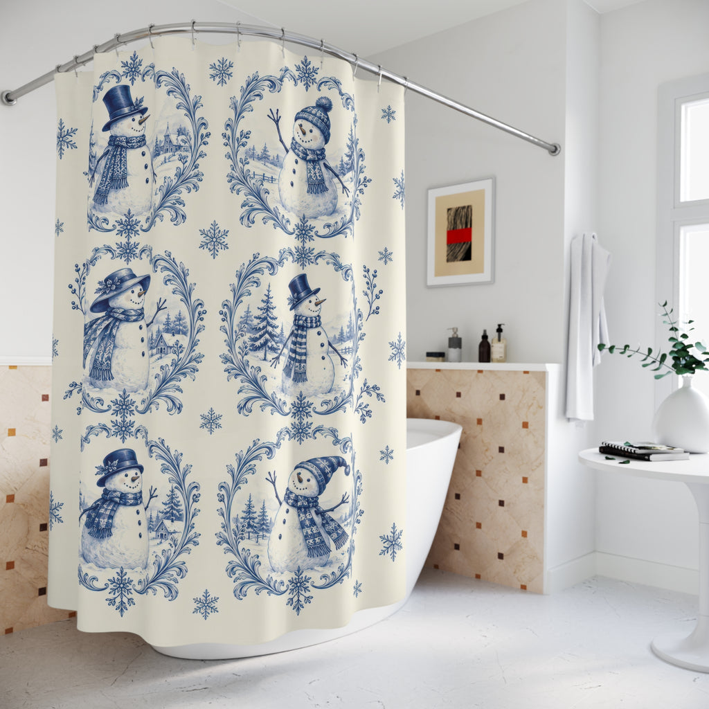 Blue snowman toile vignettes and snowflakes on ivory shower curtain beside a freestanding tub