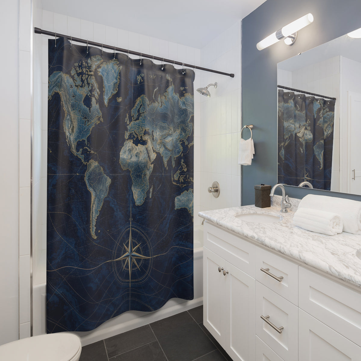Navy world map with gold-toned compass and coastlines shower curtain beside a white vanity