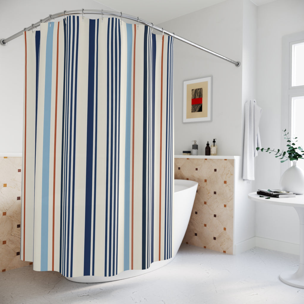 Navy pinstripes with blue and rust accents on ivory shower curtain beside a freestanding tub