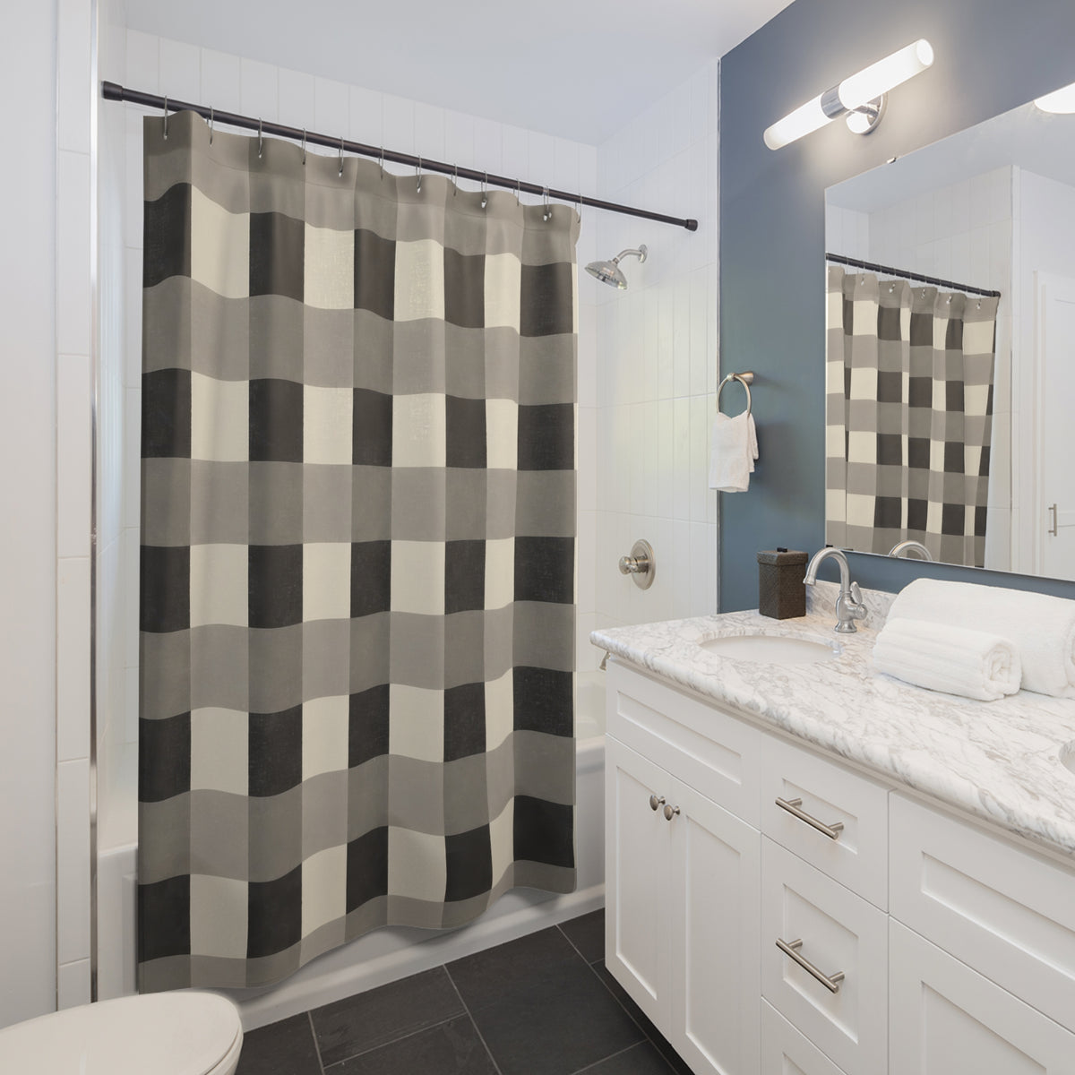 Buffalo checks in charcoal, gray and ivory shower curtain beside a white vanity