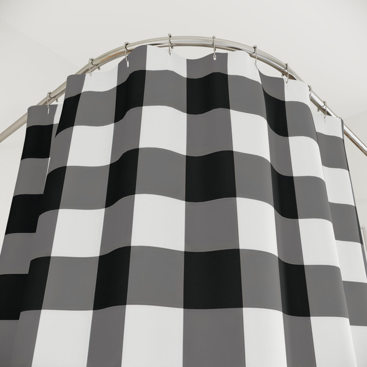 Gingham grid of black, gray and white squares shower curtain with close-up print, hooks, and folds