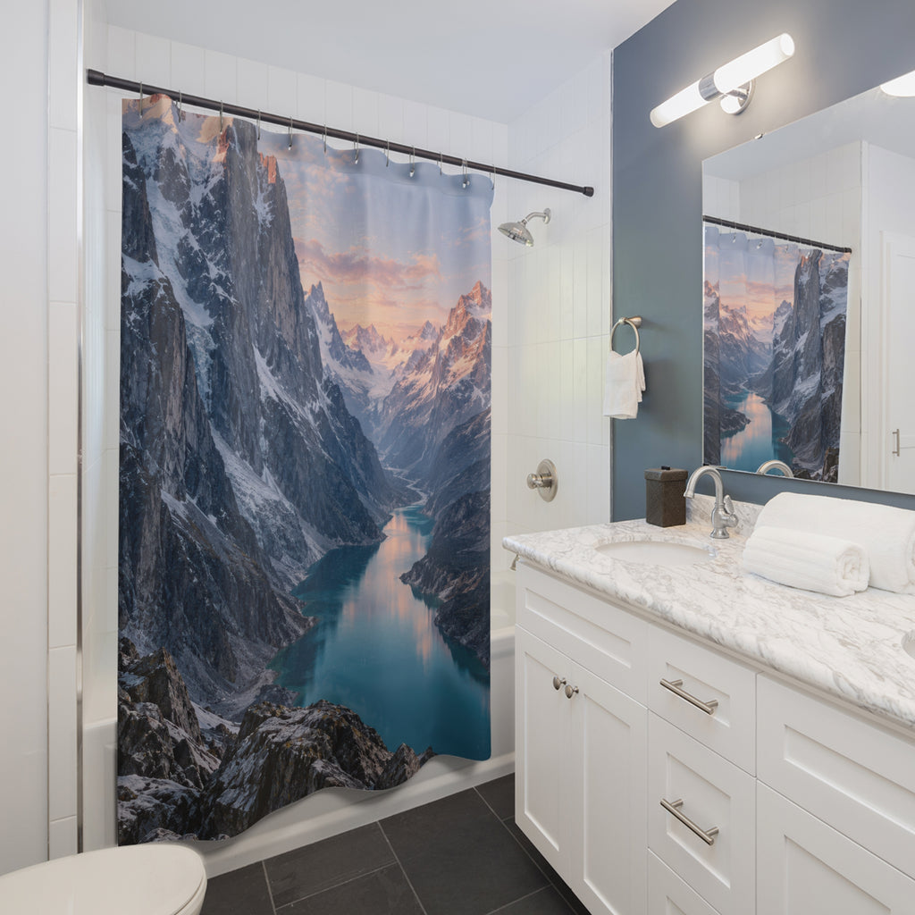 Rose-lit snowy mountains above a turquoise glacial lake shower curtain beside a white vanity