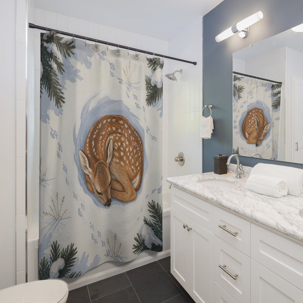 Curled fawn in snowy pine hollow shower curtain beside a white vanity