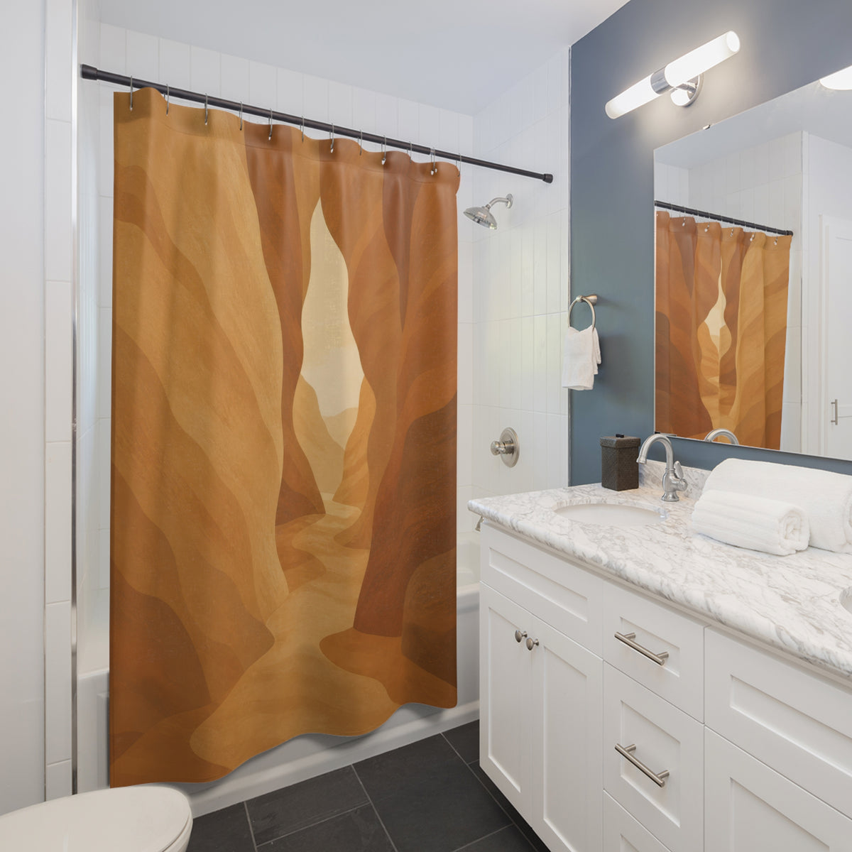 Tan desert canyon walls framing a sunlit keyhole passage shower curtain beside a white vanity