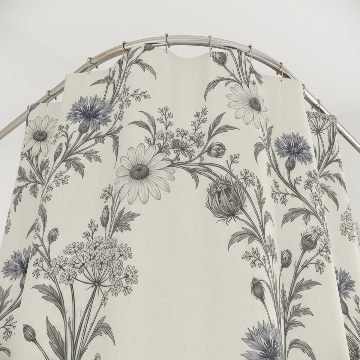 Grey daisies and cornflowers in airy garlands on ivory shower curtain with close-up print, hooks, and folds