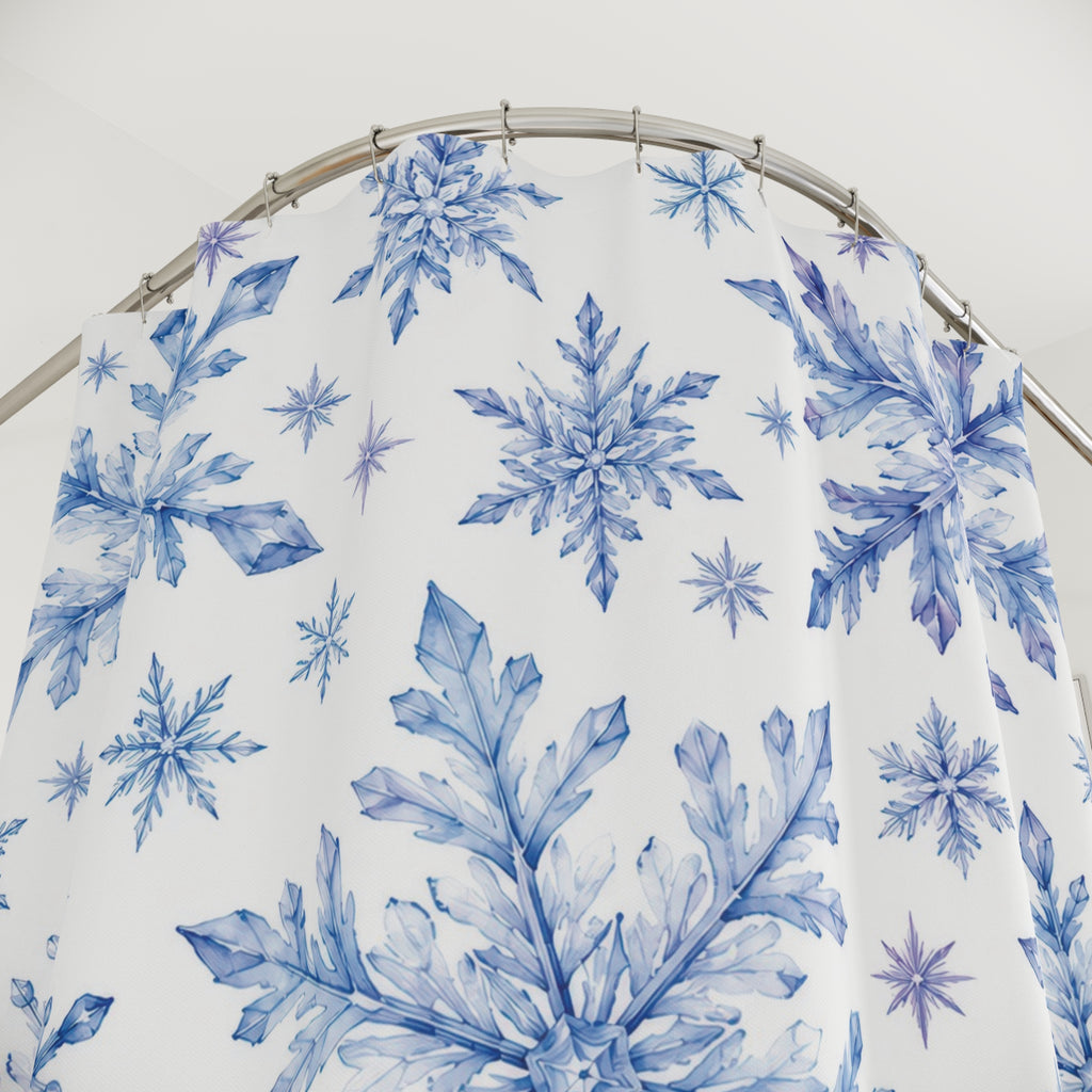 Blue and lilac watercolor snowflakes on white shower curtain with close-up print, hooks, and folds