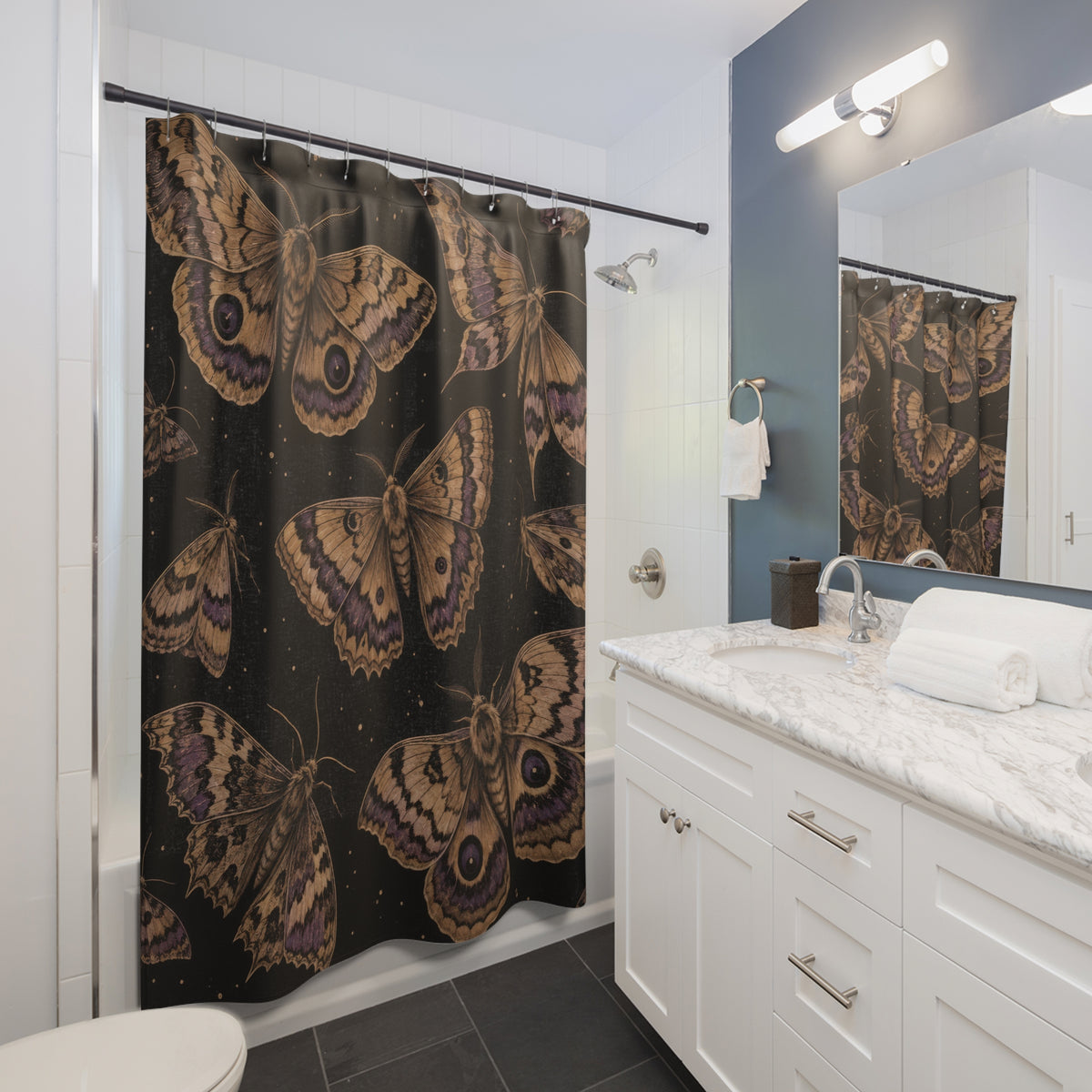 Tan moths with purple markings on black shower curtain beside a white vanity