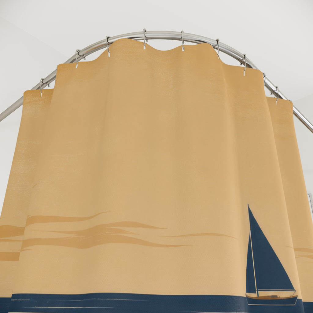 Navy sailboat crossing a broad tan sandbar under a warm sky shower curtain with close-up print, hooks, and folds