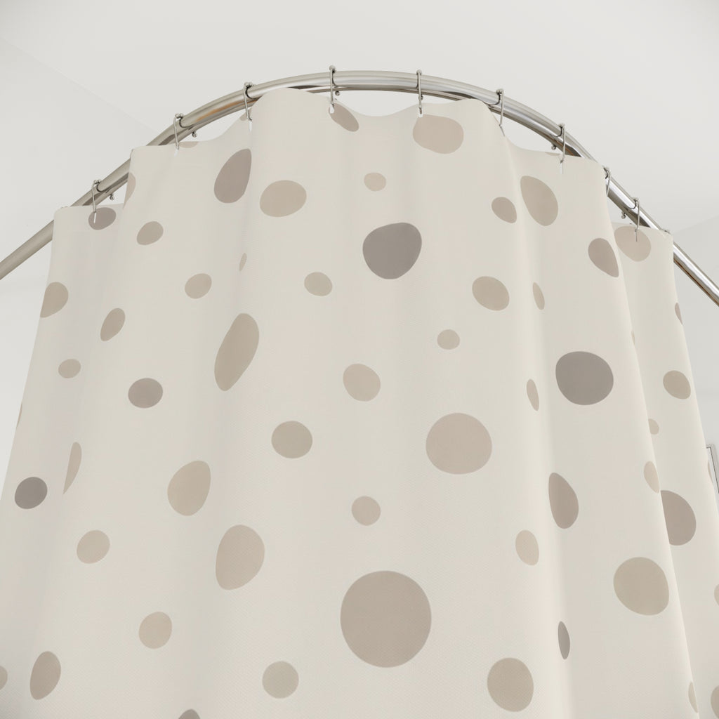Neutral cream and taupe organic polka dots shower curtain with close-up print, hooks, and folds