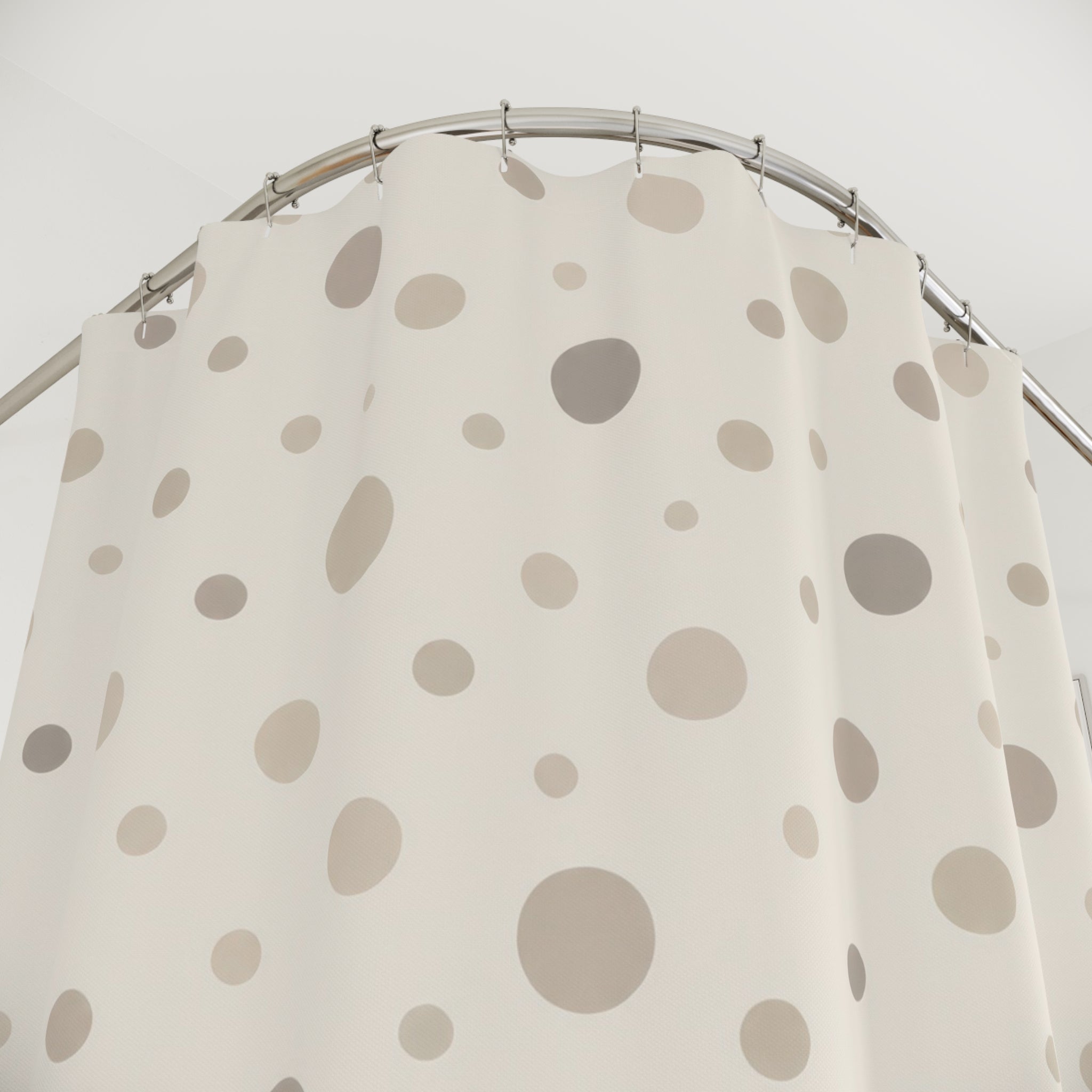 Neutral cream and taupe organic polka dots shower curtain with close-up print, hooks, and folds