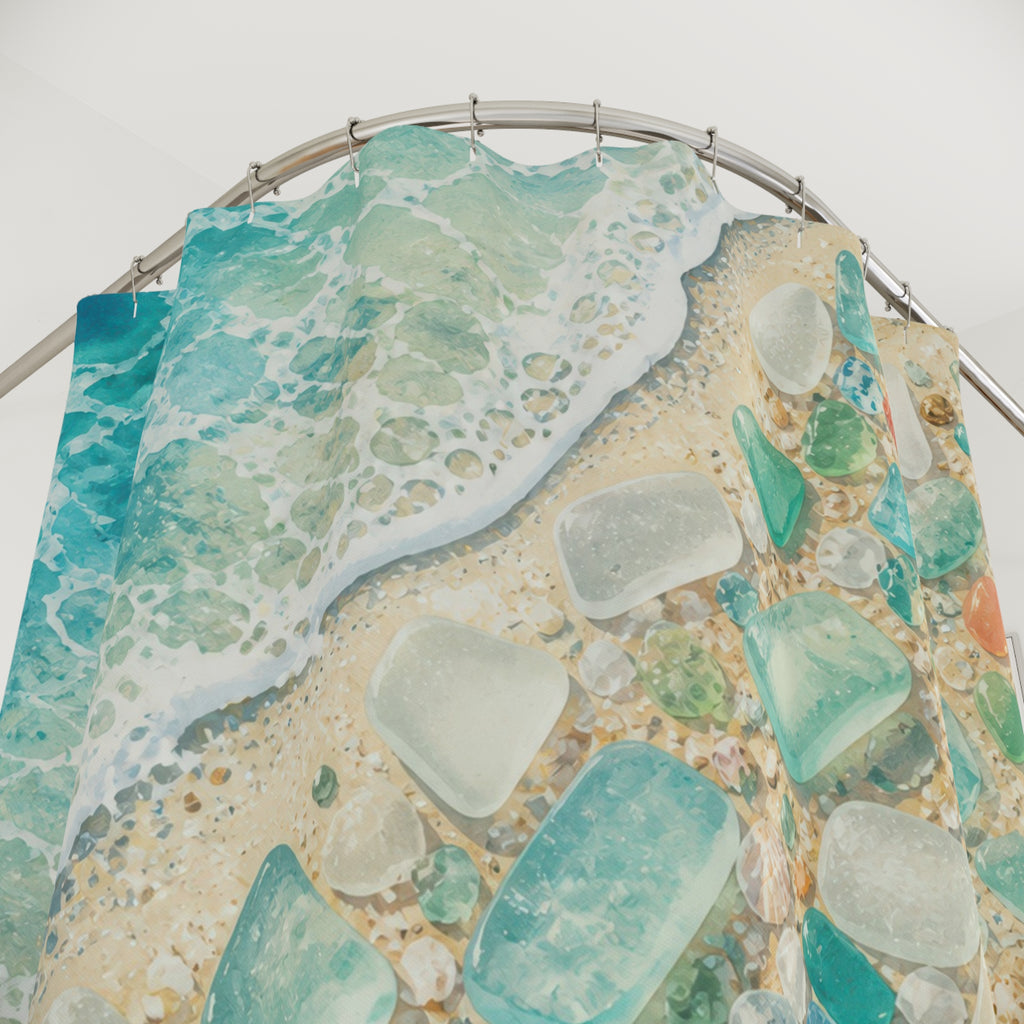 Close-up of Sea glass and shells beside a turquoise shoreline shower curtain with hooks and folds