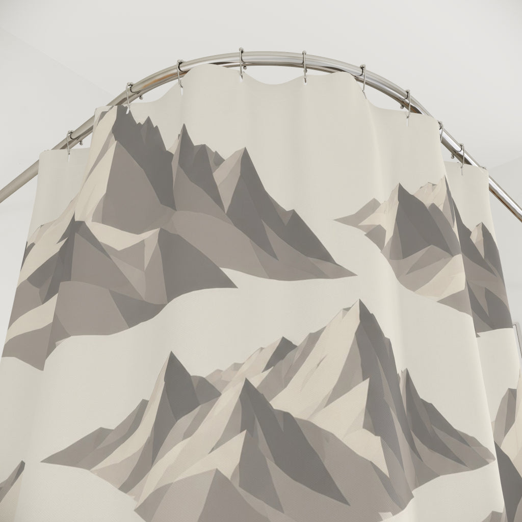 Large gray faceted mountain groups spaced diagonally across ivory shower curtain with close-up print, hooks, and folds