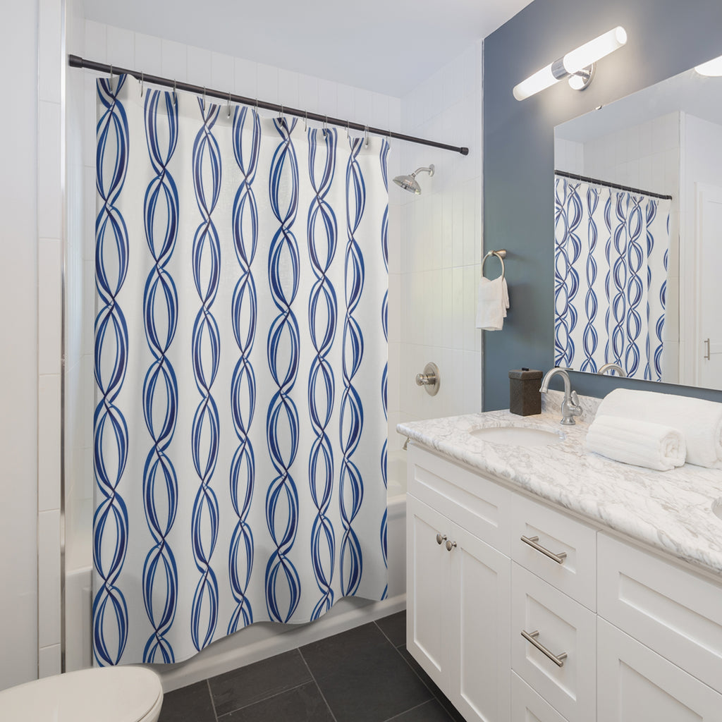 Linked blue oval loops in vertical stripes on white shower curtain beside a white vanity