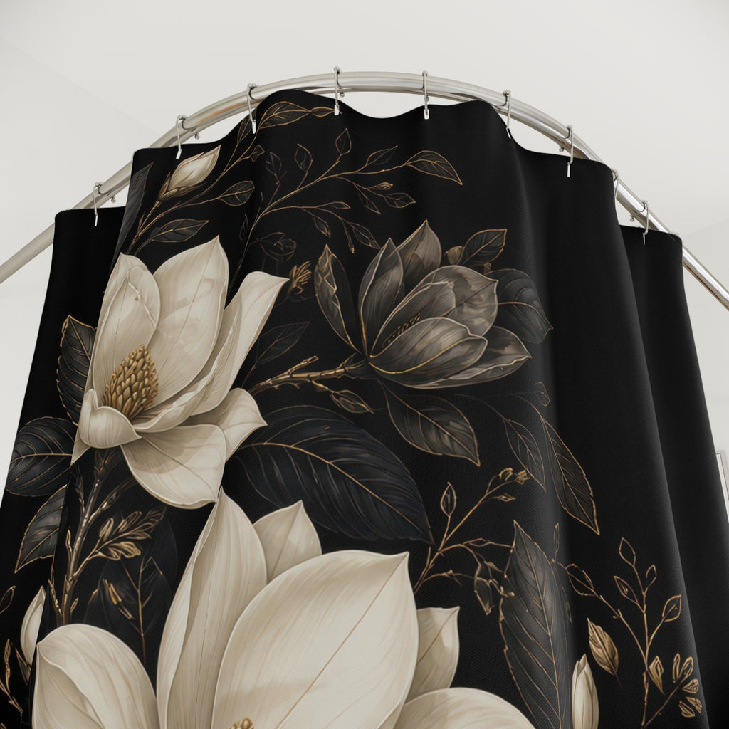Close-up of Ivory and charcoal magnolias in an oval medallion on black shower curtain with hooks and folds