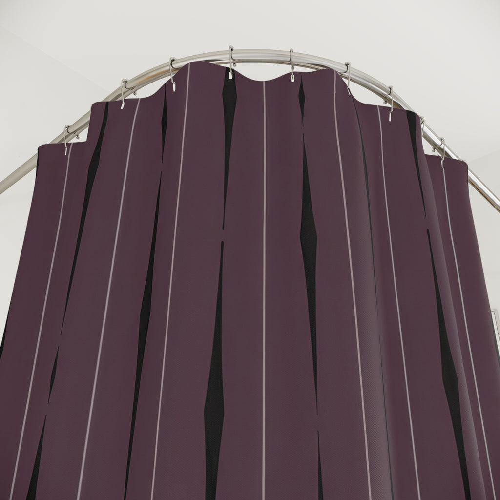 Black tapered vertical strokes and gray lines on smoky plum shower curtain with close-up print, hooks, and folds