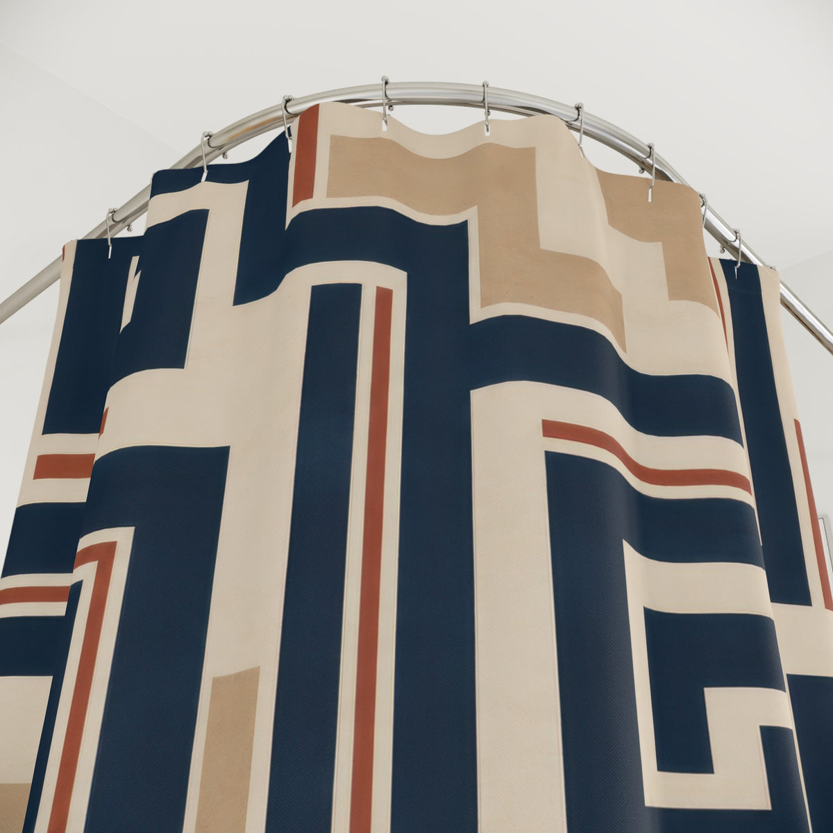 Navy rust and cream Southwestern fretwork geometric pattern shower curtain with close-up print, hooks, and folds