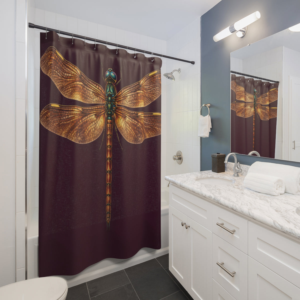 Amber-winged dragonfly on deep plum shower curtain beside a white vanity