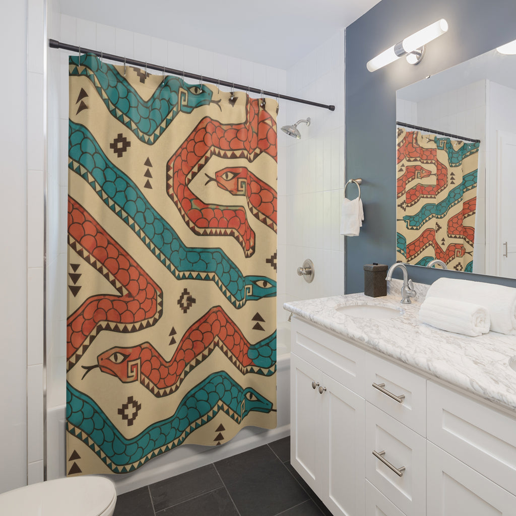 Coral and turquoise serpents on sand shower curtain beside a white vanity