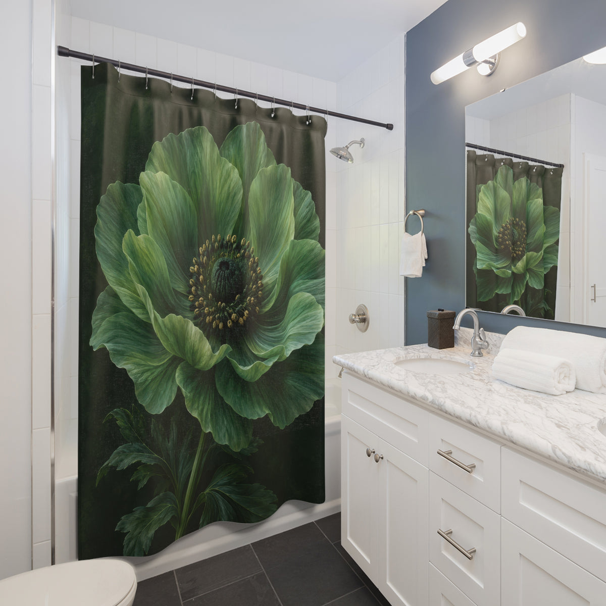 Large jade-green flower with golden stamens on dark green shower curtain beside a white vanity