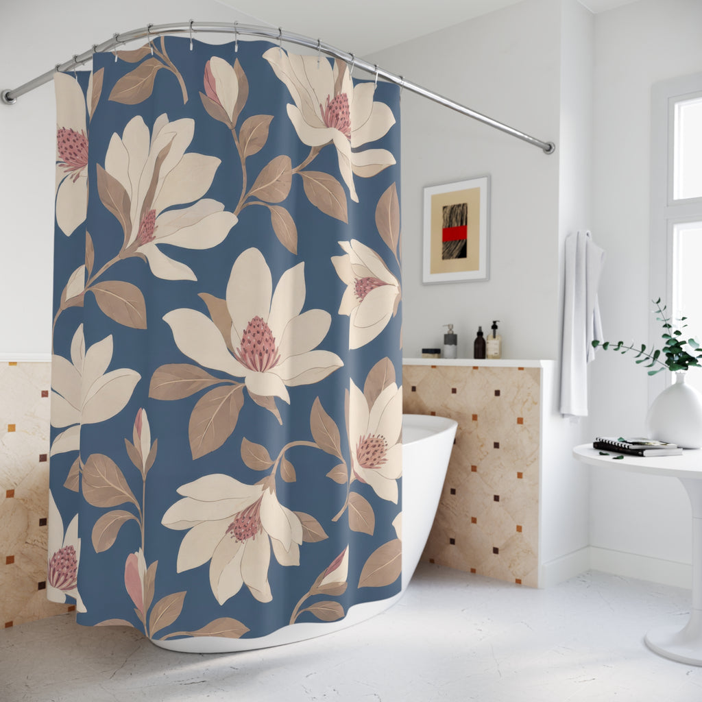 Cream and blush magnolia pattern on slate blue shower curtain beside a freestanding tub