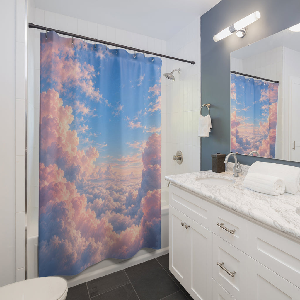 Pink cumulus clouds around an open blue sky shower curtain beside a white vanity