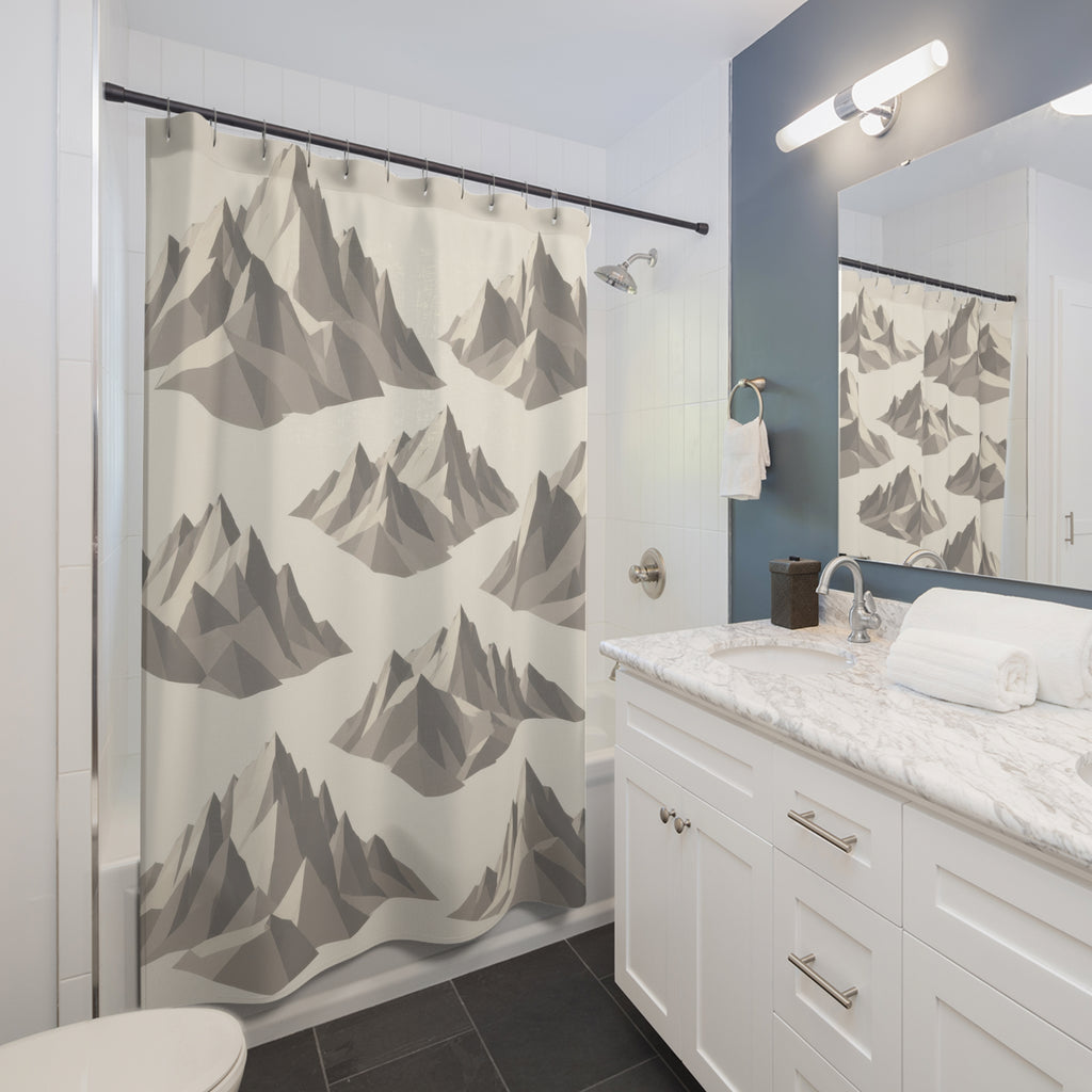 Large gray faceted mountain groups spaced diagonally across ivory shower curtain beside a white vanity