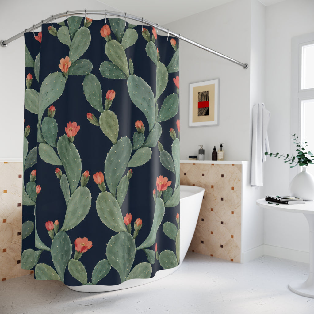 Sage prickly pear cactus with coral flowers on navy shower curtain beside a freestanding tub