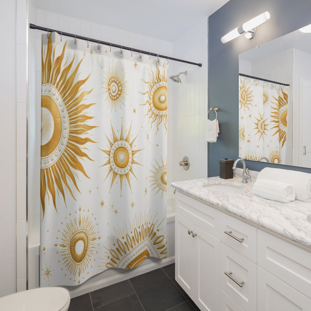 Gold sun medallions and starbursts on white shower curtain beside a white vanity