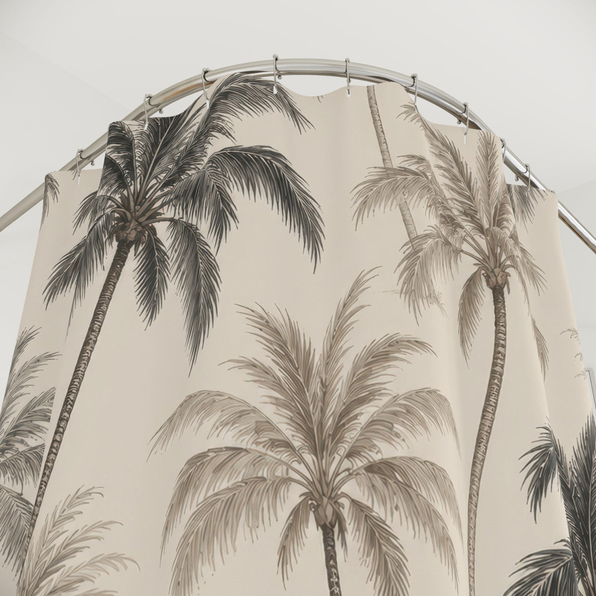 Charcoal and taupe palm trees in a cream botanical toile shower curtain with close-up print, hooks, and folds