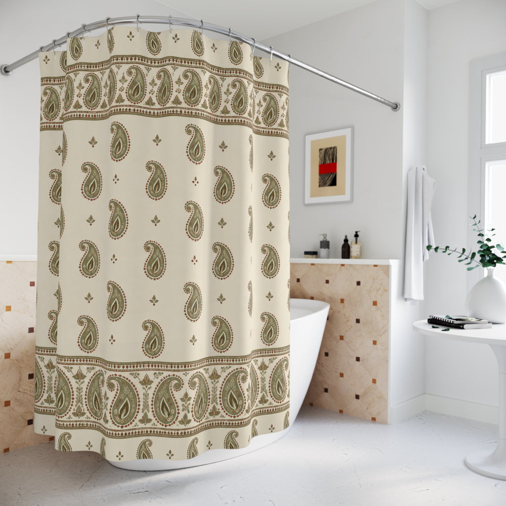 Sage paisley borders and rust outlines on cream shower curtain beside a freestanding tub