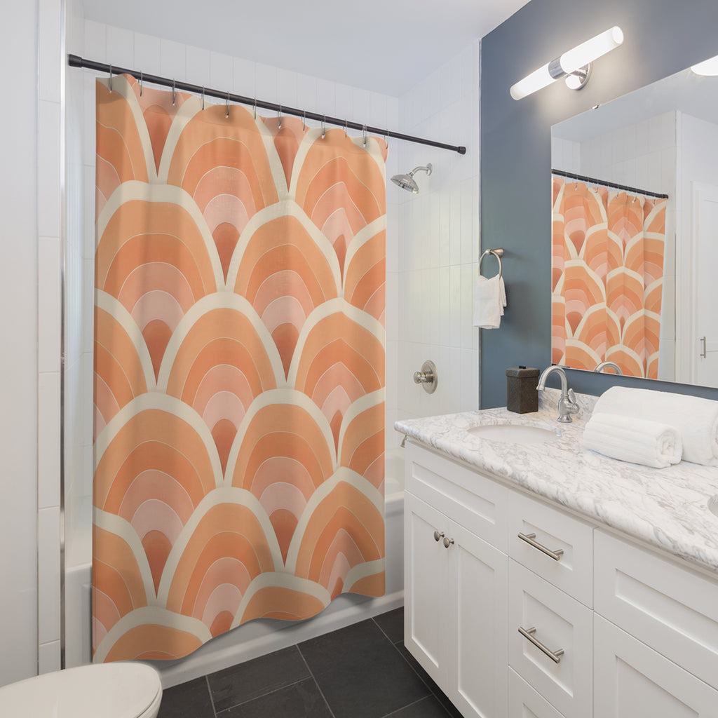 Peach Art Deco fan pattern shower curtain beside a white vanity