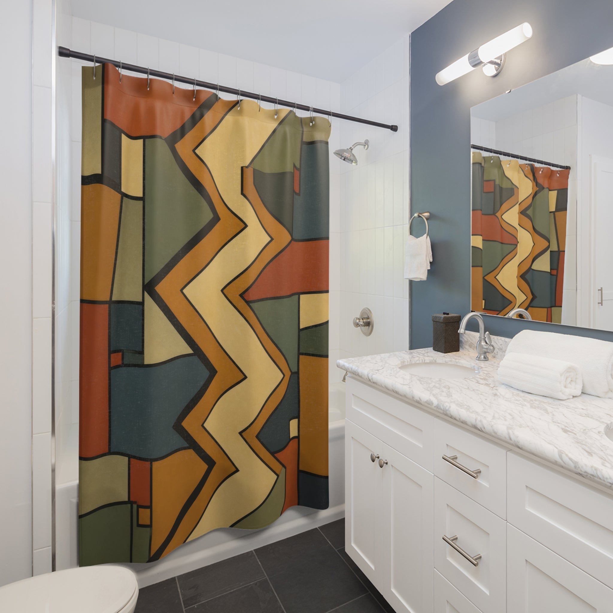 Ochre rust and sage central zigzag spine with compartments shower curtain beside a white vanity