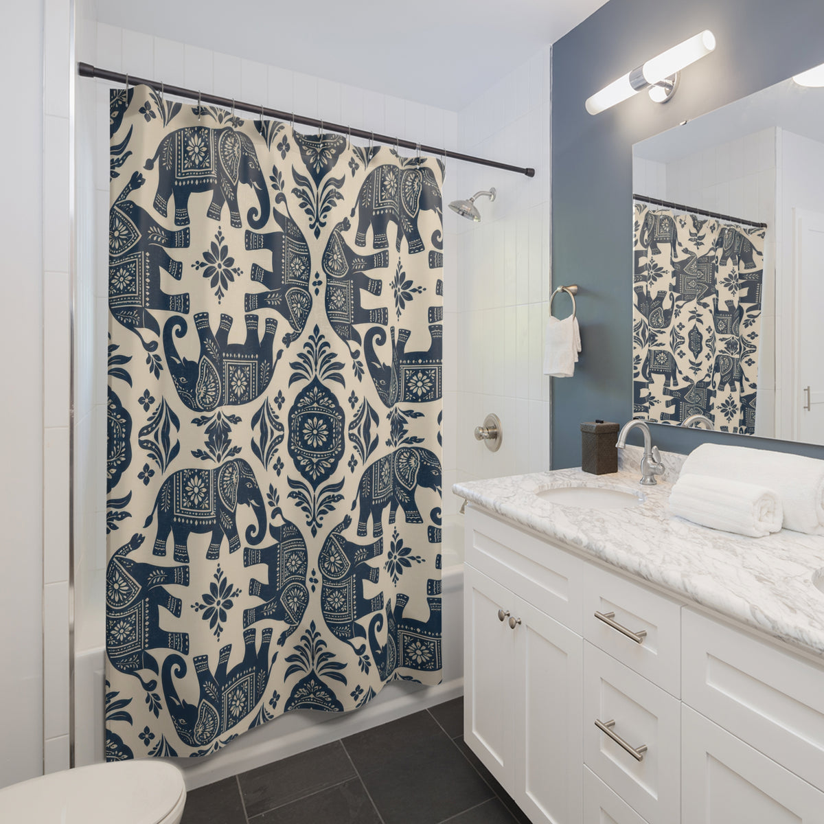 Indigo elephant folk pattern shower curtain beside a white vanity