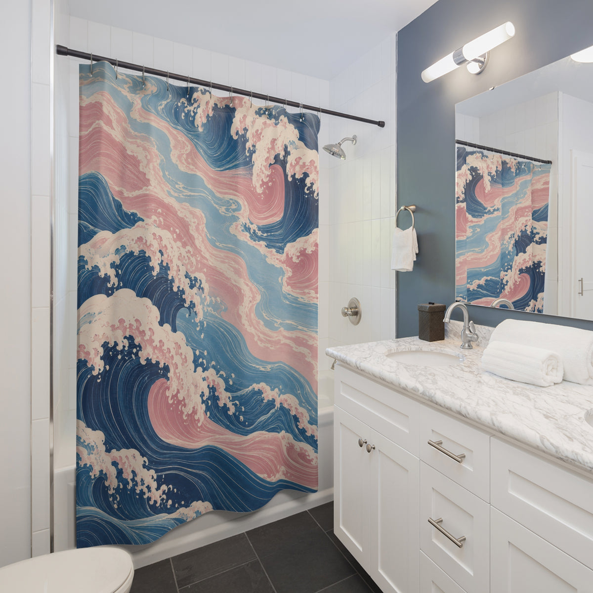 Blue and pink curling waves with ivory foam shower curtain beside a white vanity