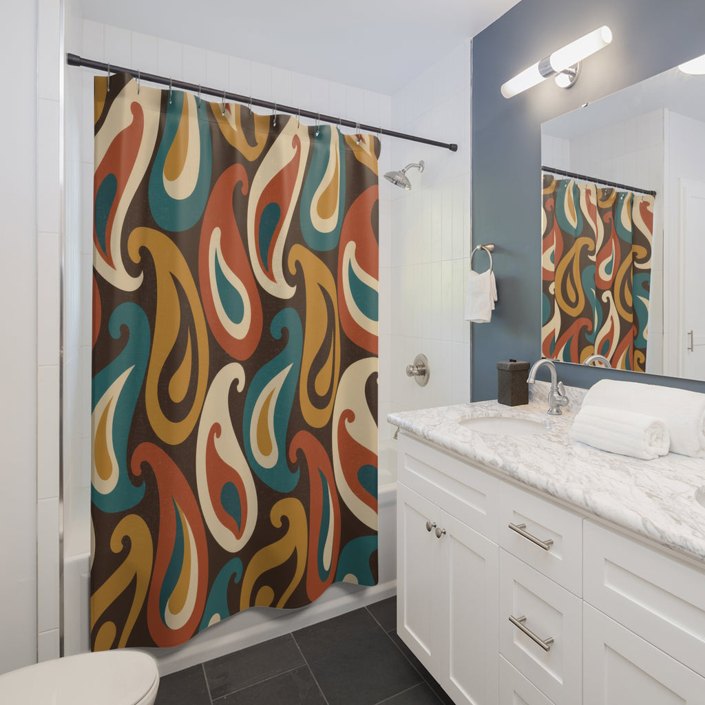 Teal, mustard, rust and cream paisleys on brown shower curtain beside a white vanity