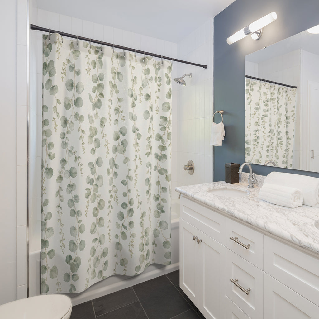 Green Botanical sage eucalyptus hanging shower curtain beside a white vanity
