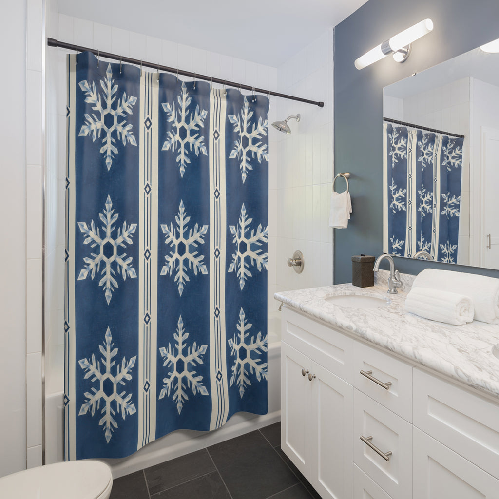 Indigo striped white snowflakes shower curtain beside a white vanity