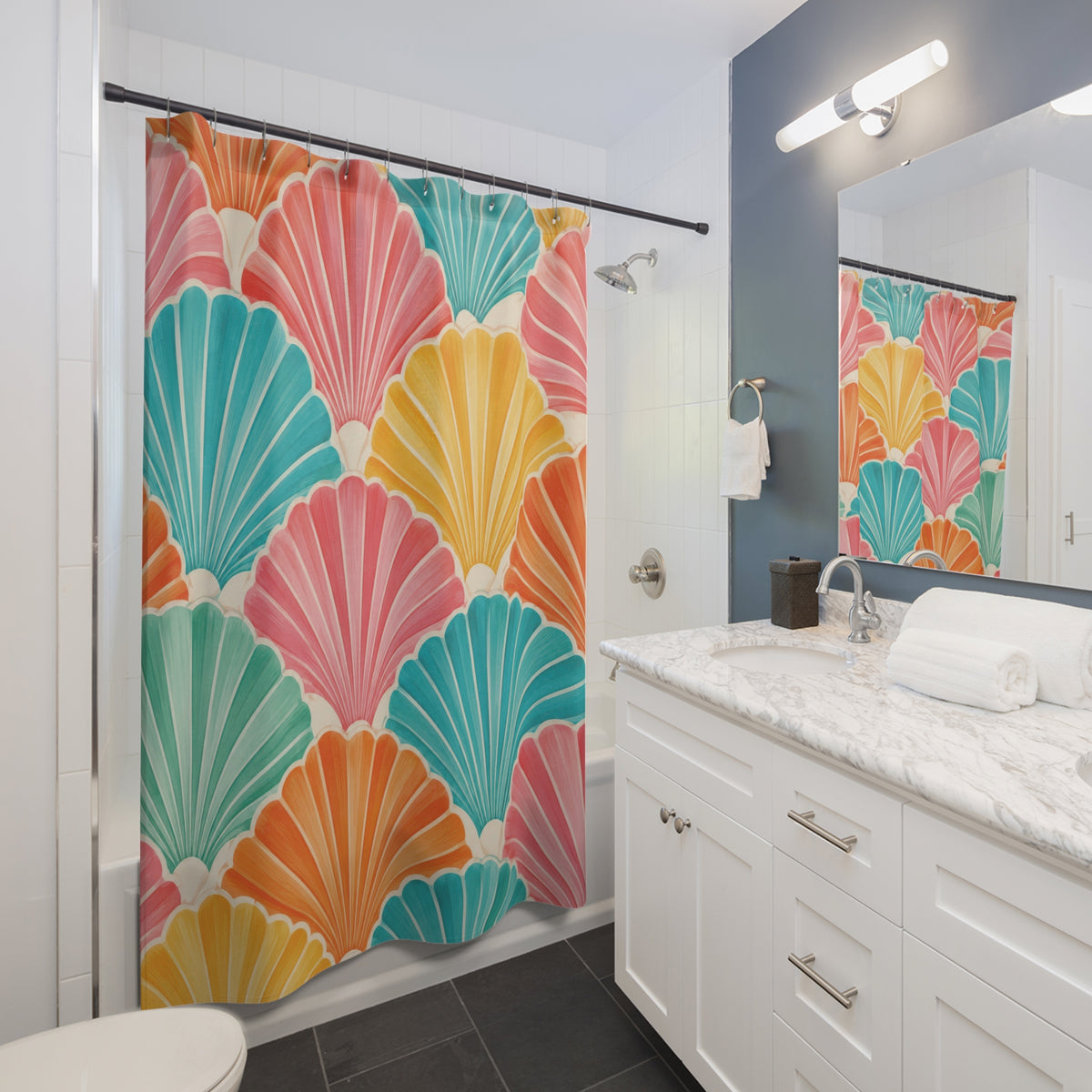 Pink, turquoise, orange and yellow scallop shells with cream ribs shower curtain beside a white vanity