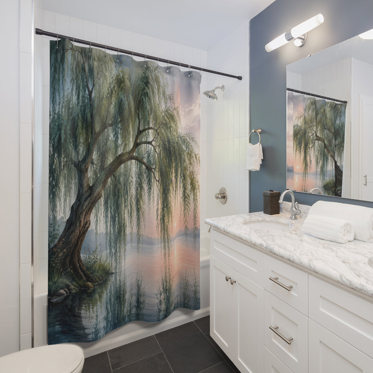 Misty lakeside weeping willow shower curtain beside a white vanity
