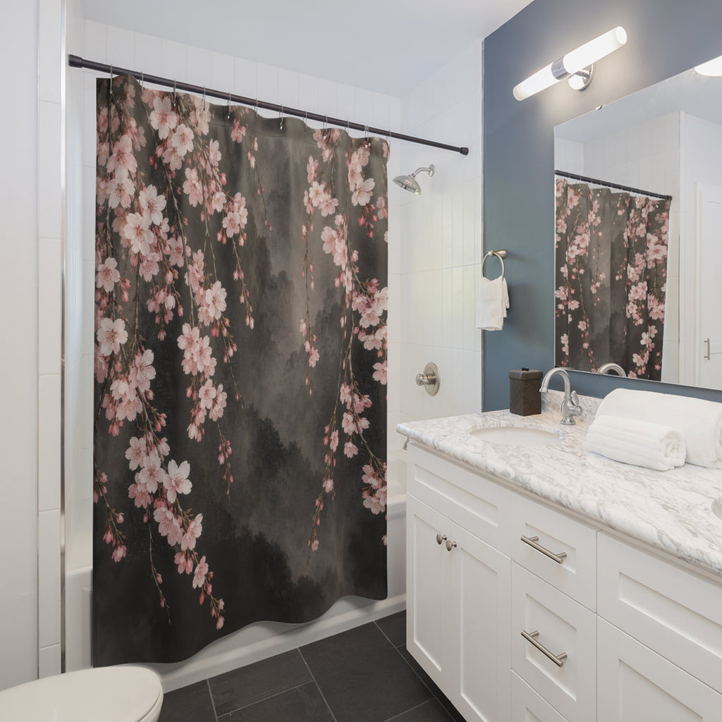 Blush cherry blossom branches on smoky charcoal shower curtain beside a white vanity