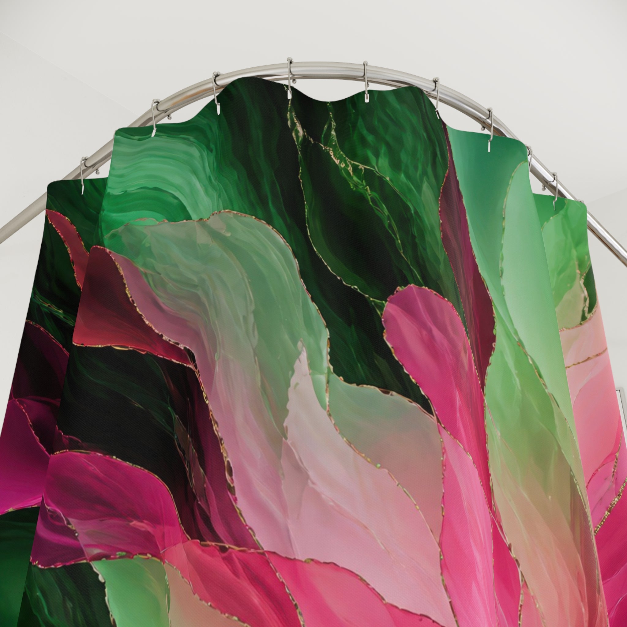 Green and pink radiating jewel bloom shower curtain with close-up print, hooks, and folds