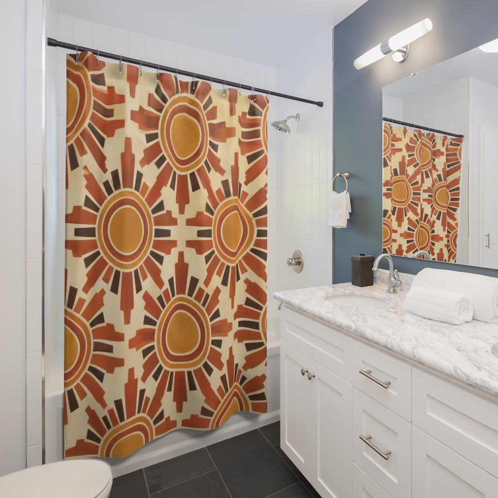 Ochre suns with terracotta rays on cream shower curtain beside a white vanity